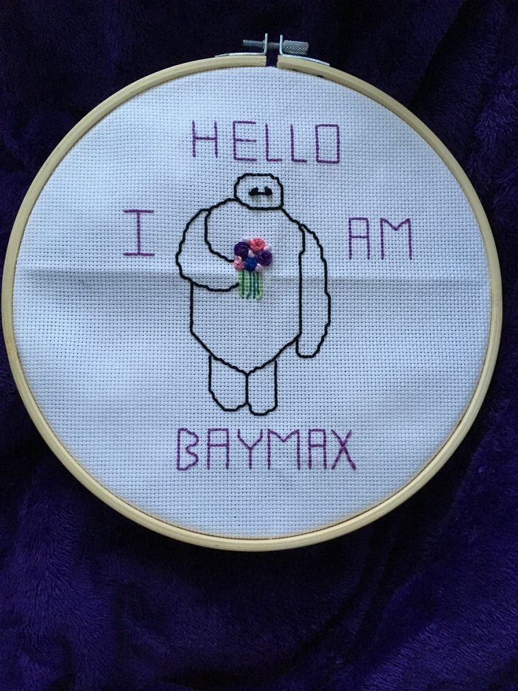 Baymax from Big Hero Six with flowers saying hello I am Baymax