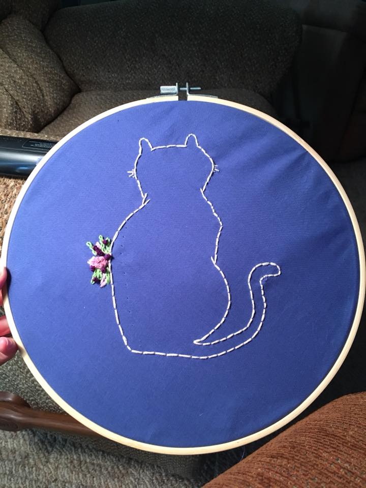 outline of a cat with flowers